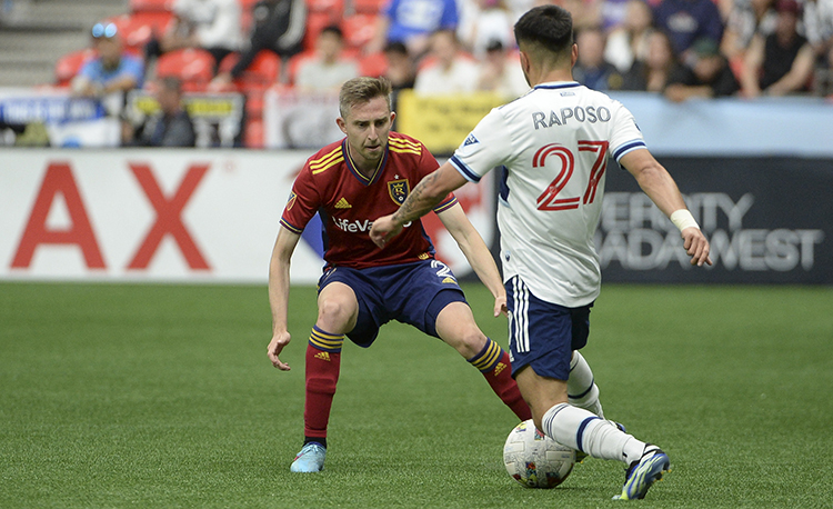 soccer player defending against attacker